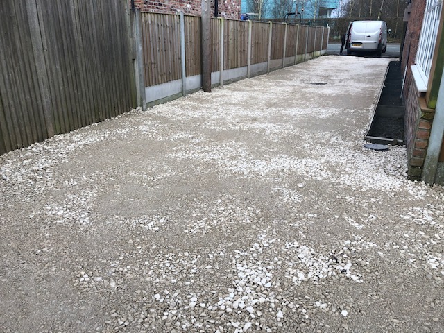 Access to rear of houses kept flooding. Installed gully pots with land drain. Laid 20 ton of MOT and compacted ready to be driven on