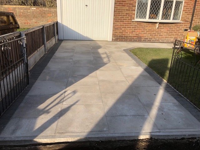 New Driveway with extended walkway to house. 600x600 flags with charcoal border