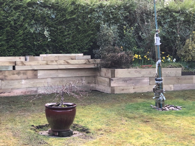 Replaced corroded 35 year old retaining wall with new sleepers